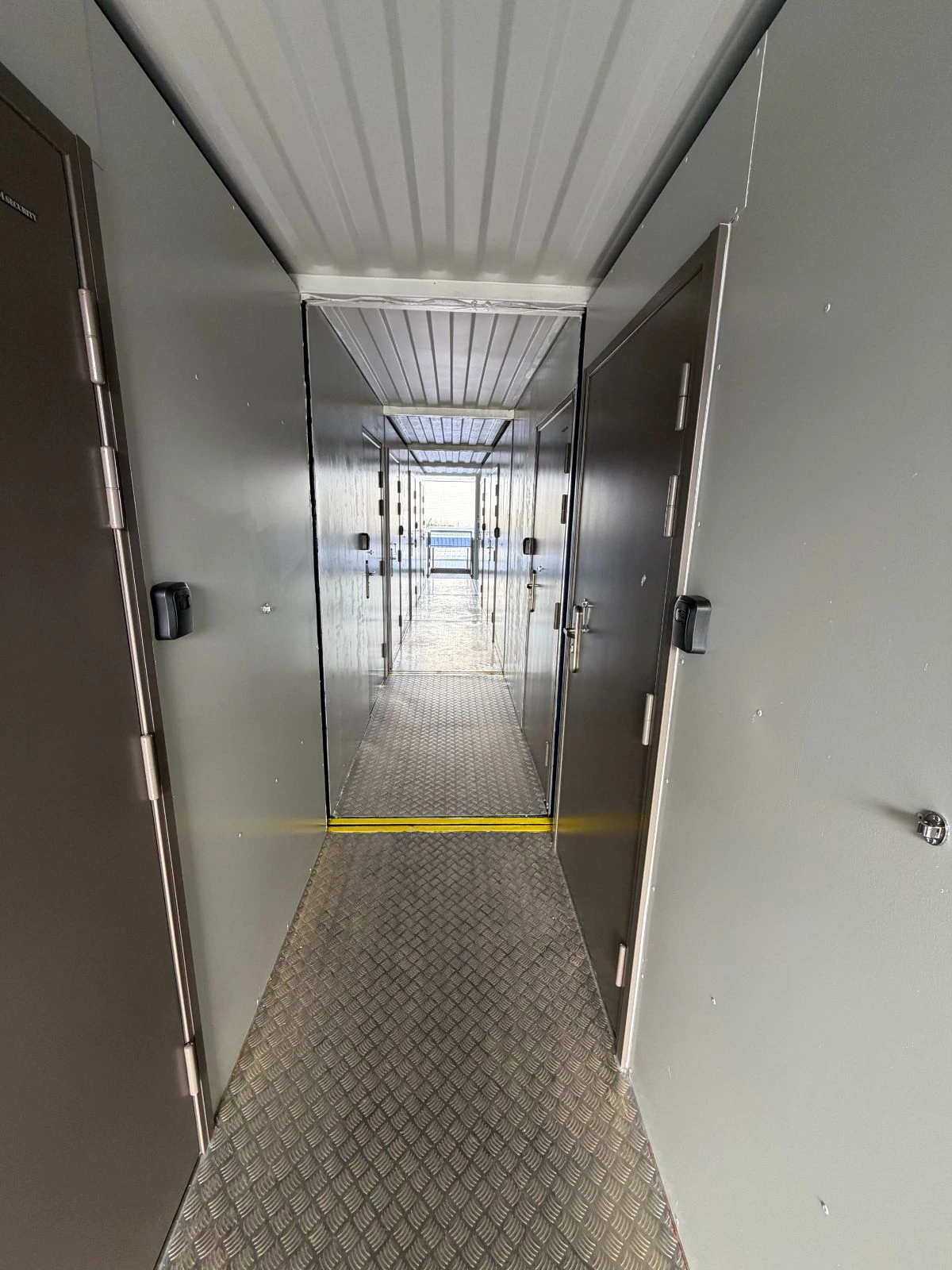 Secure corridor between small container units