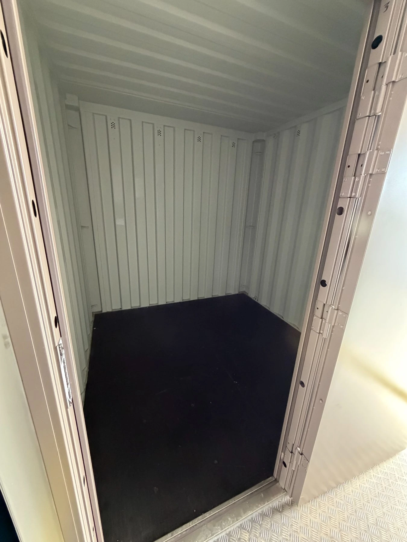 Looking through the open door of a small container