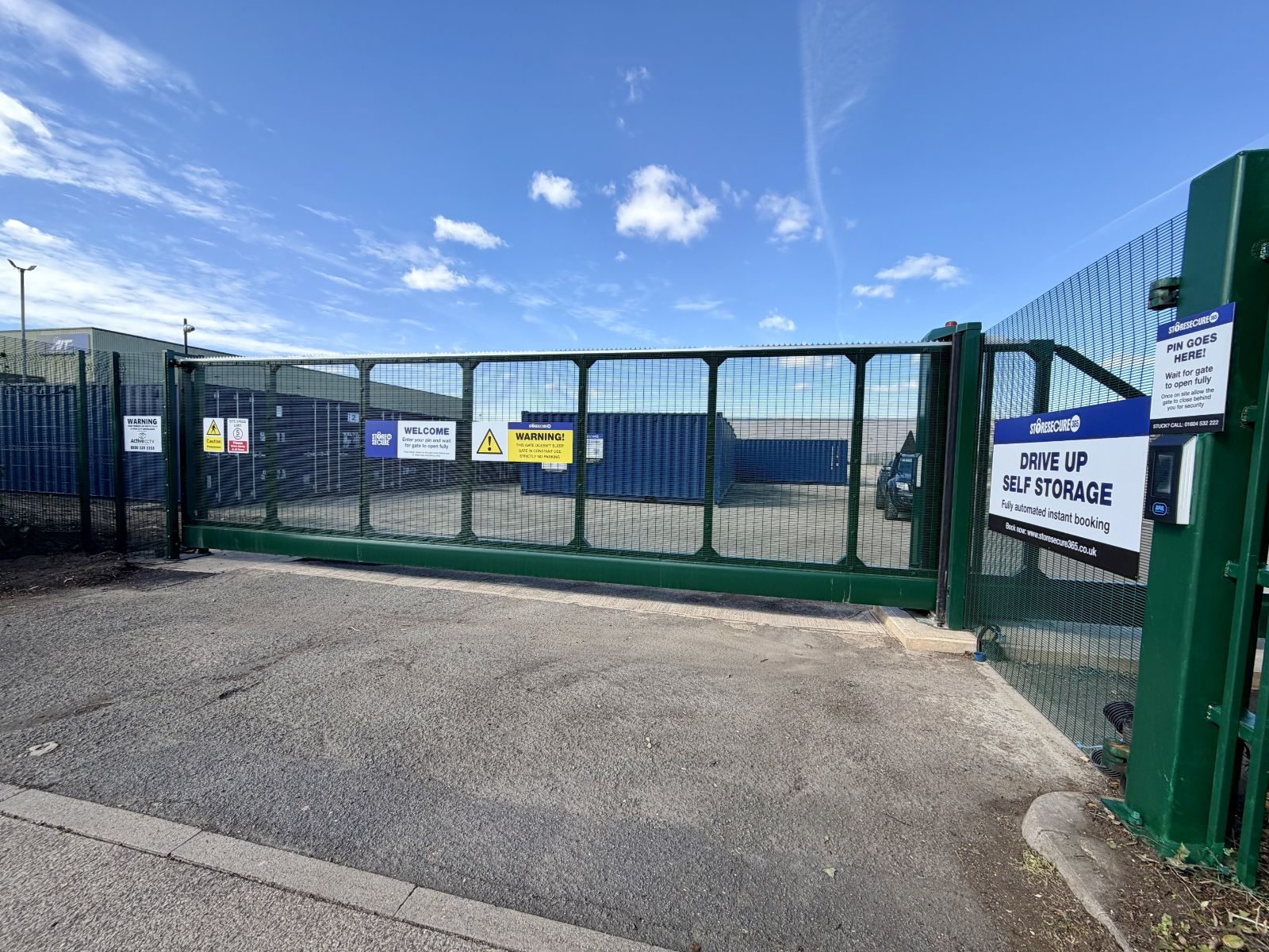 Secure gated entrance to the outdoor vehicle parking compound